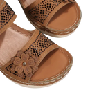 Brown flower-embellished sandals.