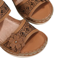 Brown flower-embellished sandals.
