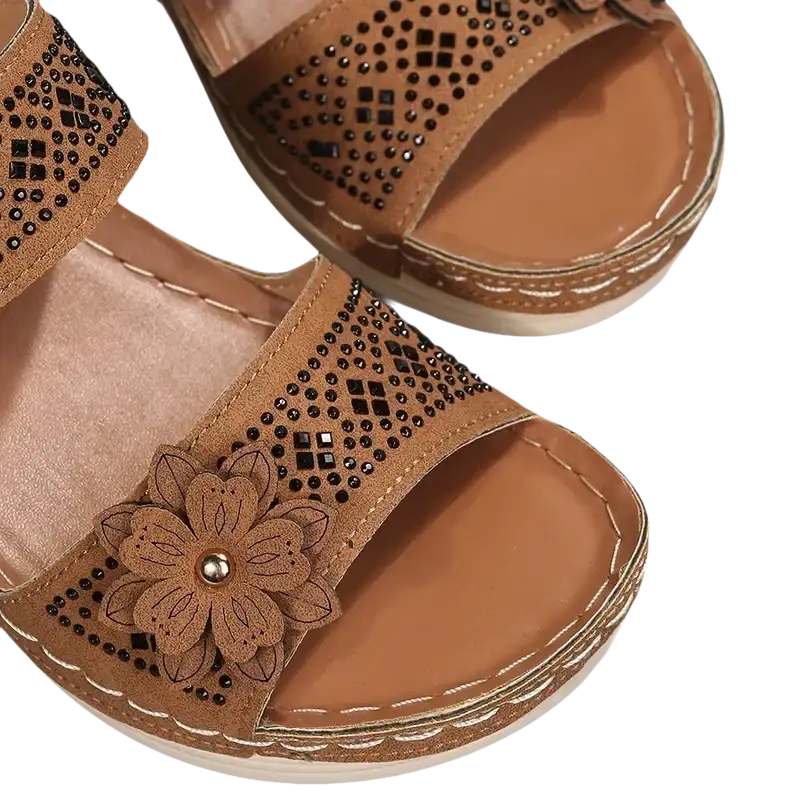 Brown flower-embellished sandals.