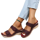 Burgundy floral-embellished platform sandals.