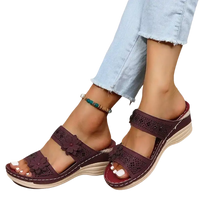 Burgundy floral-embellished platform sandals.
