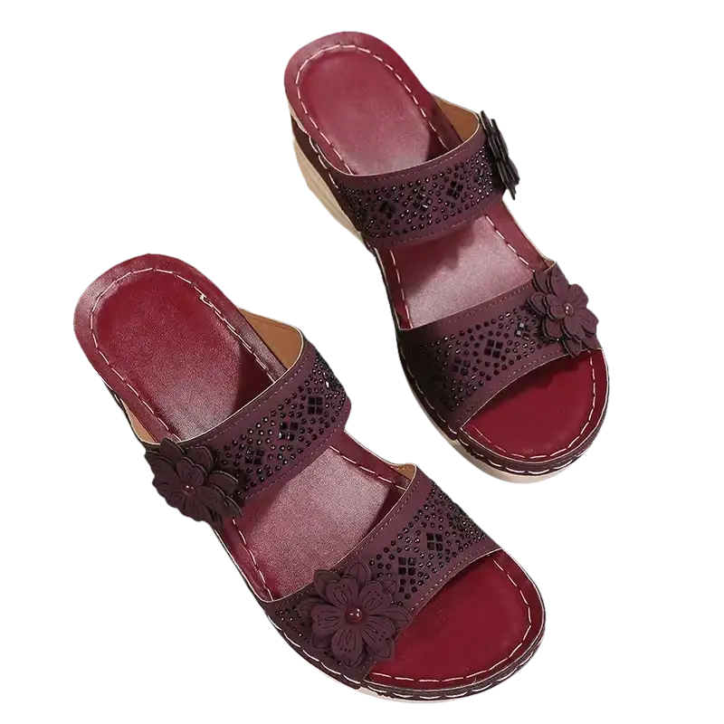 Burgundy floral-accented wedge sandals.