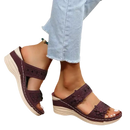 Burgundy floral-accented wedge sandals.
