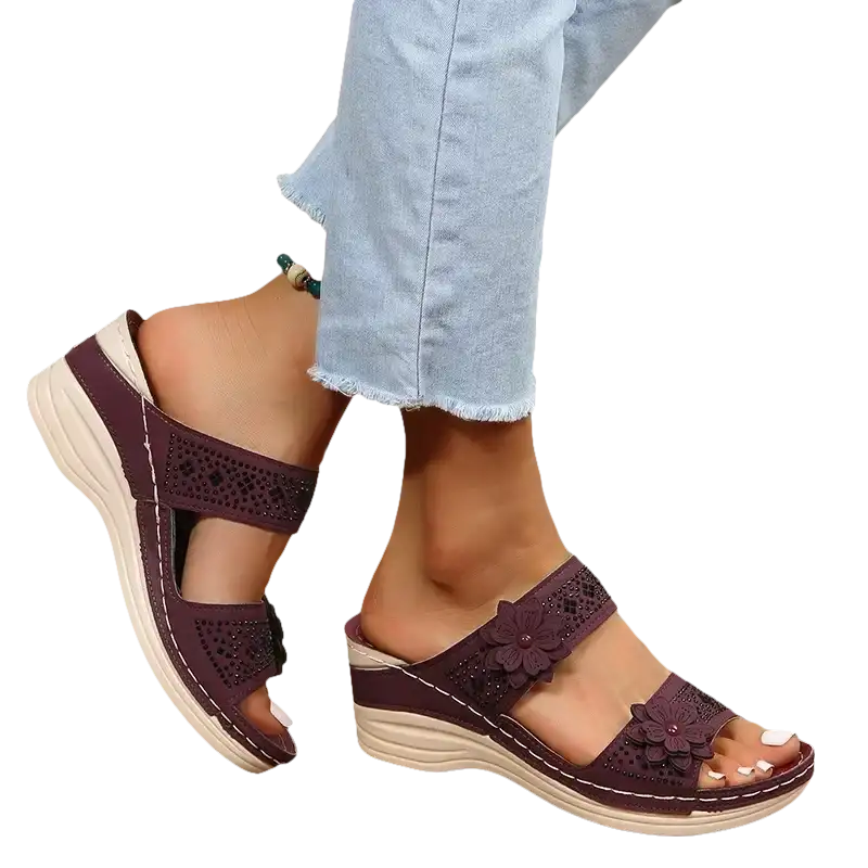 Burgundy floral-accented wedge sandals.