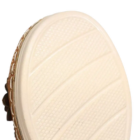 Cream-colored shoe sole with textured grip.
