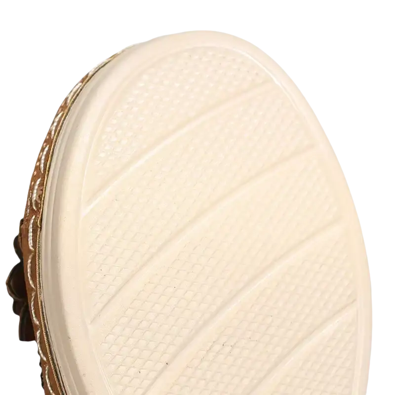 Cream-colored shoe sole with textured grip.