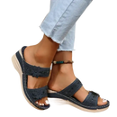 Navy blue floral-embellished wedge sandals.