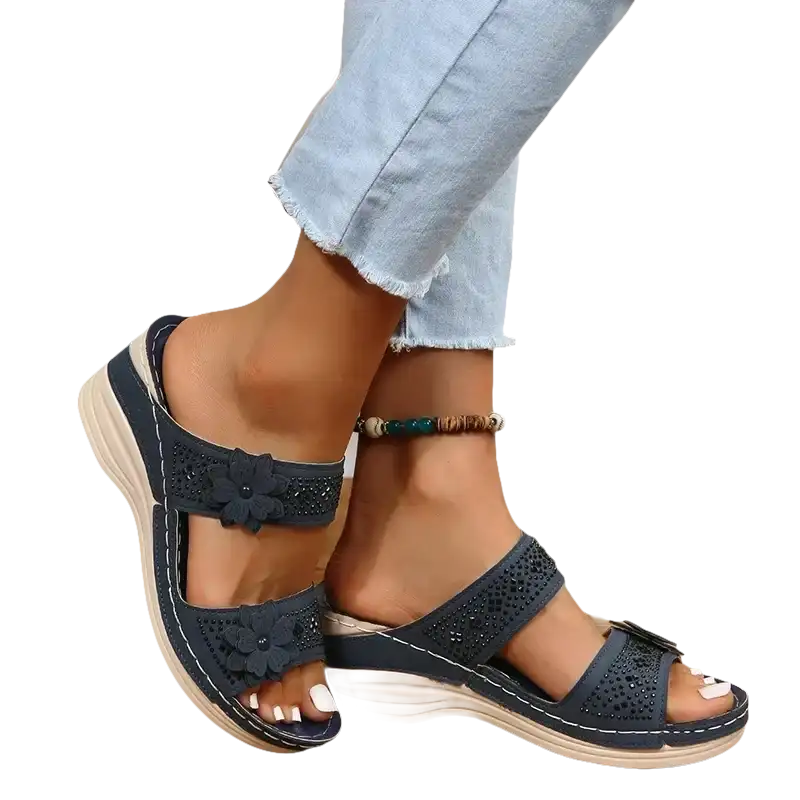 Navy blue floral-embellished wedge sandals.