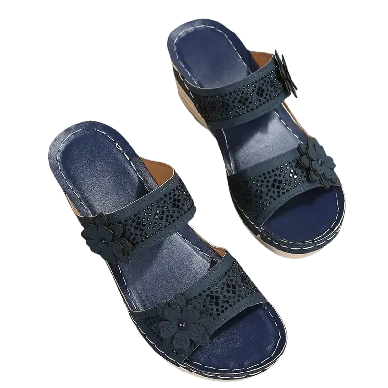 Navy blue floral wedge sandals.