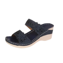 Navy wedge sandal with floral embellishments.