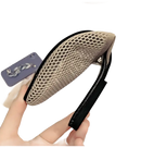 Beige mesh flat shoe.