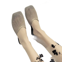 Beige mesh mules with floral stockings.
