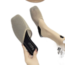 Beige mesh slip-on shoe.