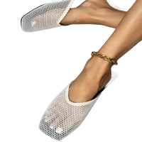 White mesh slip-on shoes.