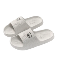 White bear-themed slide sandals.