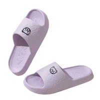 Lavender cartoon bear slippers.