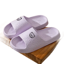 Lavender bear-themed slide sandals.