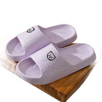 Lavender bear-themed slide sandals.