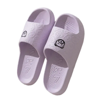 Pair of lavender cartoon-decorated slide sandals.