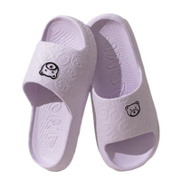 Pair of lavender cartoon-themed slide sandals.