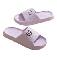 Pair of lavender bear-themed slide sandals.