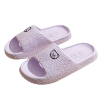 Lavender bear-themed slide sandals.