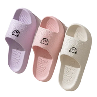 Three pastel-colored cartoon-decorated slides.