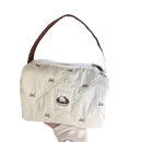 Quilted white handbag with brown strap.