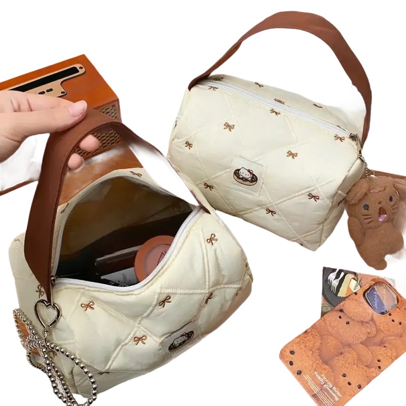 Quilted cream-colored handbag with brown handle.