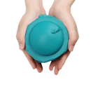 Trendy teal inflatable neck pillow held in hands for travel comfort and fun adventures