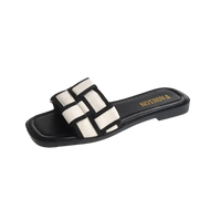 Black and white woven slide sandal.