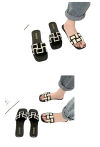 Black and white patterned slide sandals.