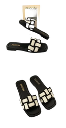 Black and white woven slide sandals.
