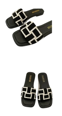 Black and white woven slide sandals.