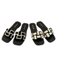 Black and white woven slide sandals.