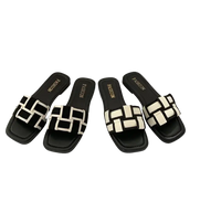Black and white woven slide sandals.