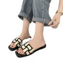 Woven black and white slide sandals.