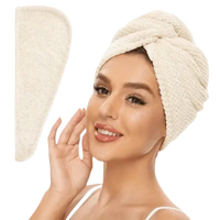 Cream-colored hair towel wrap.