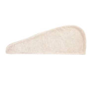Beige hair drying towel.