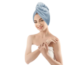 Woman wearing a blue towel turban.