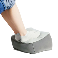 Gray inflatable toughage tri-cushion footrest with a person’s foot on top, super trendy and multifunctional pillow toughage