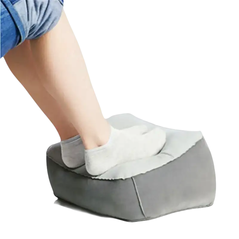 Gray inflatable toughage tri-cushion footrest with a person’s foot on top, super trendy and multifunctional pillow toughage