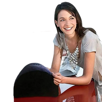 Red convertible car with Toughage Tri-Cushion trendy inflatable foot pillow in view