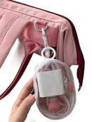Pink bag with clear charger case.