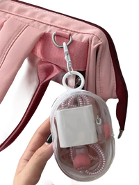 Pink bag with clear charger case.