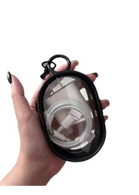 Black-rimmed clear case holding a white charger and cable.