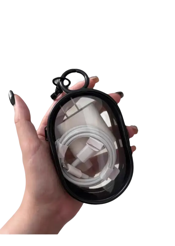 Black-rimmed clear case holding a white charger and cable.