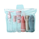 Clear travel toiletry bag with assorted containers.