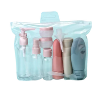 Clear travel toiletry bag with assorted containers.