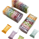 Colorful individually wrapped towels in clear boxes.